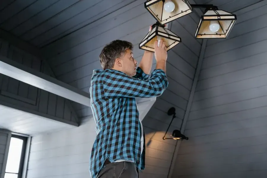 Property owner assessing ceiling water damage in a Fairfax County home